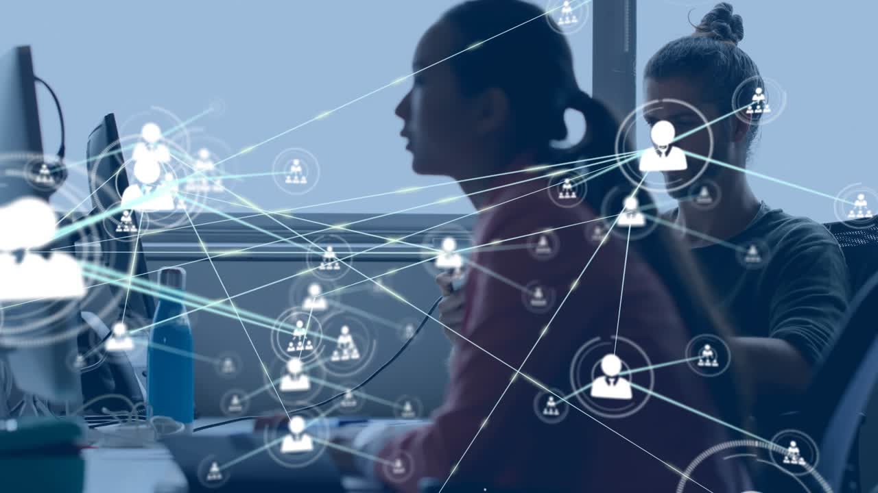 Animation of network of connections with icons over diverse business people using computer at office