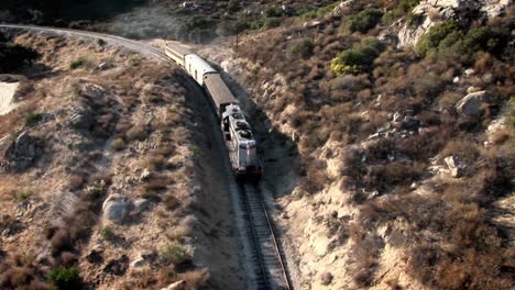 A-train-travels-through-a-mountainous-area