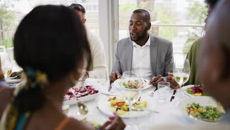 diverse group of people having a festive meal