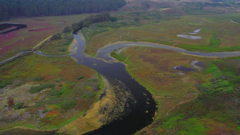 aerial drone view overlooking waterways in slow descent into swamp