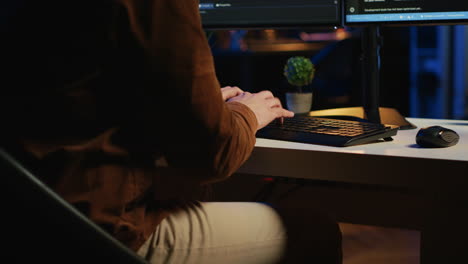 software engineer typing on keyboard buttons, writing lines of code, close up