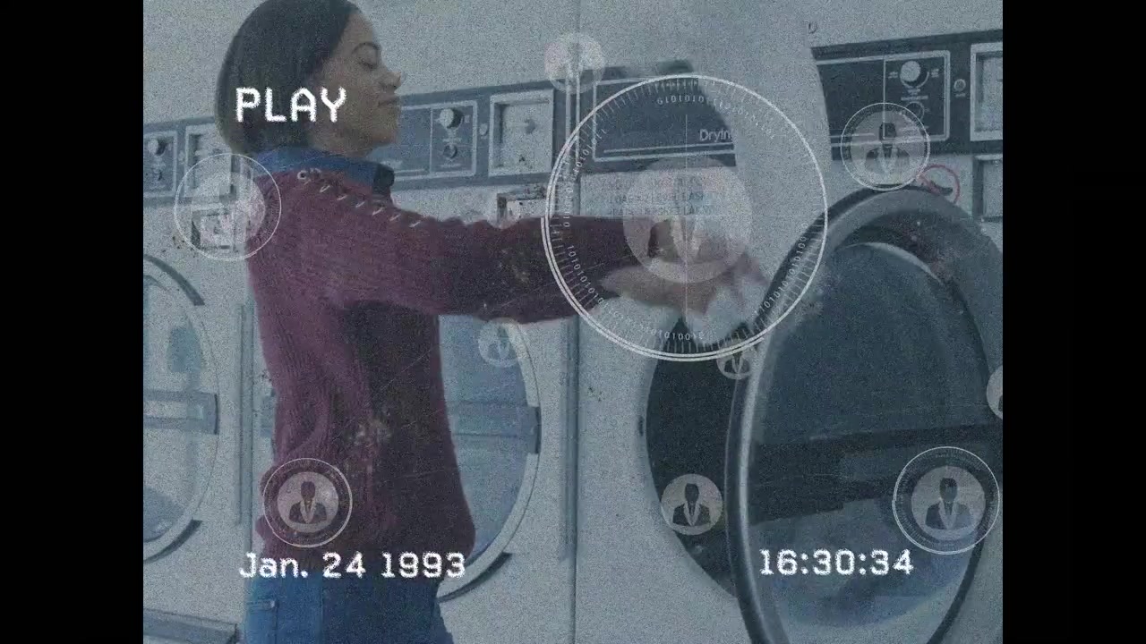 Video of young woman removing clothes from washing machine with networking icons
