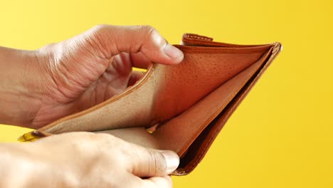 Man-hand-open-an-empty-wallet-with-copy-space