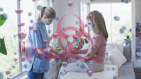 Animation-of-virus-cells-and-biohazard-icon-over-caucasian-senior-woman-and-nurse-wearing-face-masks