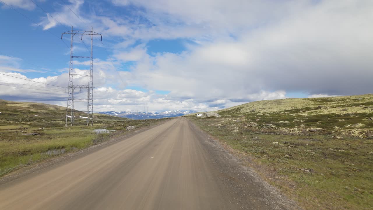 Empty Remote Road Through Mountainous Terrain In Sladalsvegen, Norway. POV Shot