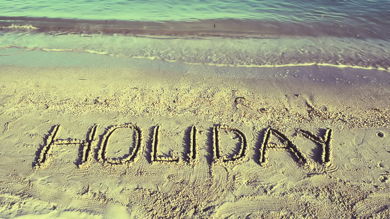 Opschrift Vakantie op zand, het strand. Opnamen op het strand.