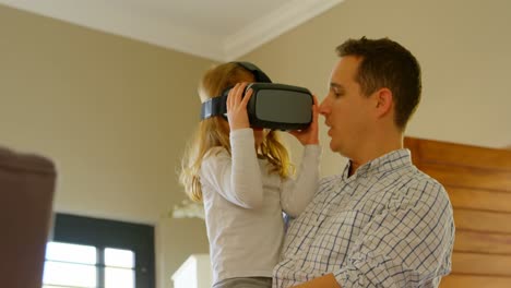 girl using virtual reality headset with her father 4k