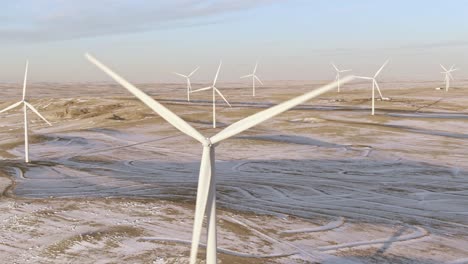 Aerial-shots-of-wind-turbines-on-a-cold-winter-afternoon-in-Calhan,-Colorado