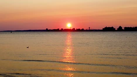 sunset over nyc brooklyn, aerial pano from breezy point