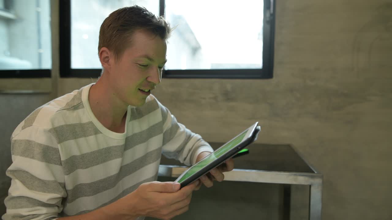 Young handsome Scandinavian man at home