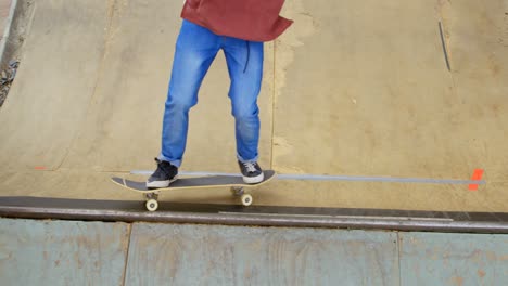 high angle view of young man doing skateboard trick on skateboard ramp at skateboard court 4k