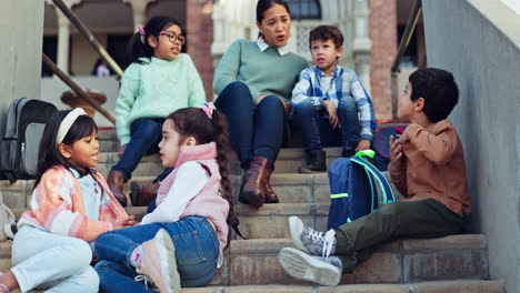 Education,-teacher-and-children-on-stairs