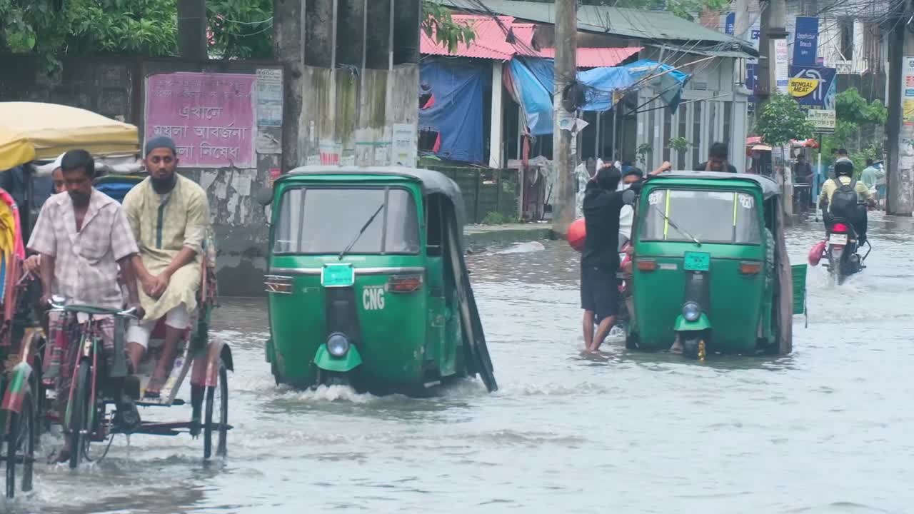 Sylhet Bangladesh flooded city street from heavy monsoon rain due to climate change