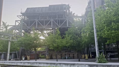 abandoned factory premises with an old railway line in front