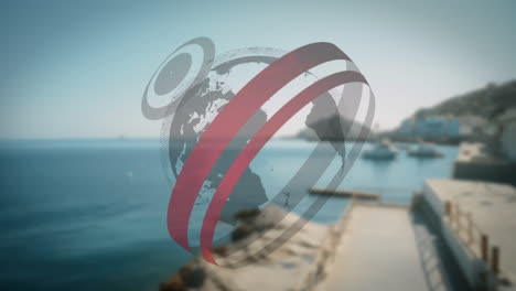 rotating globe animation over coastal landscape with clear blue sky