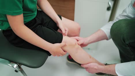 doctor working with patient in hospital. close up of rehabilitation physiotherapy worker with client