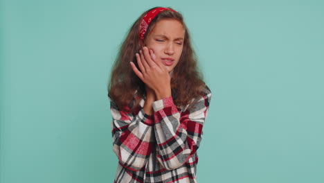 child girl touching cheek, suffer from painful toothache, sensitive teeth, cavities, dental problem