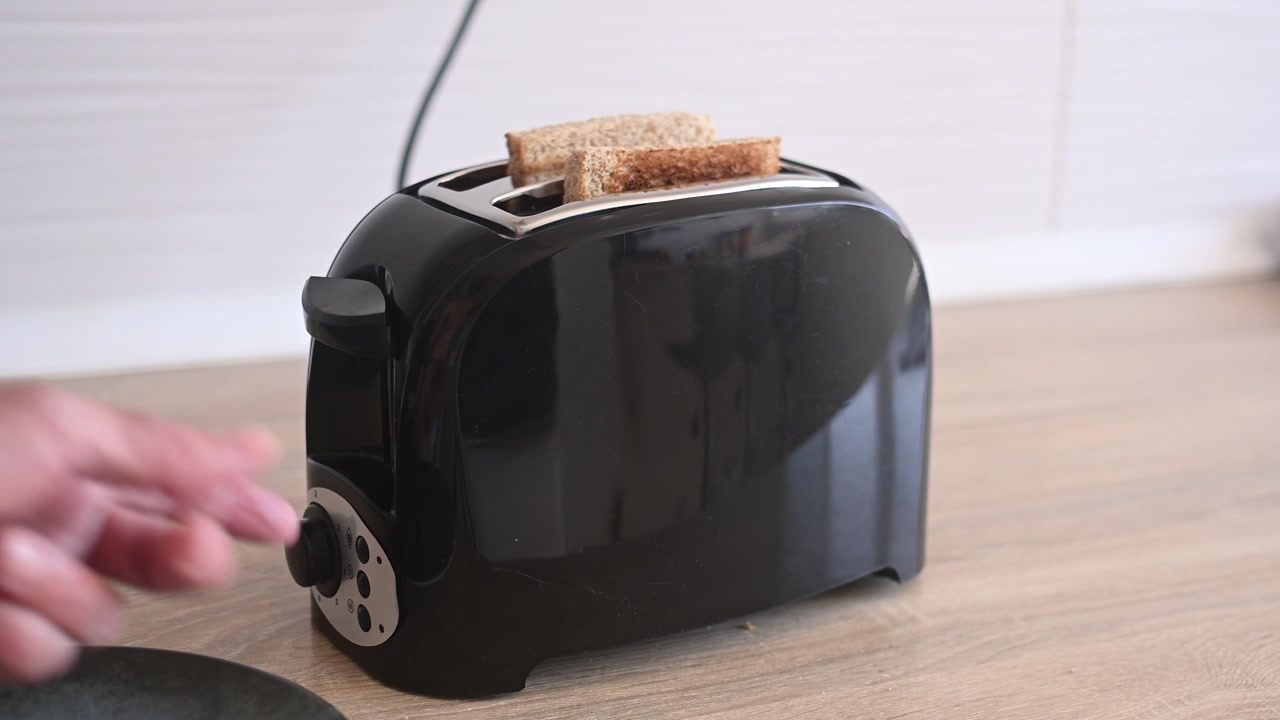 Preparing toast for breakfast in the kitchen