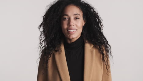 african american woman in of camera on white background.