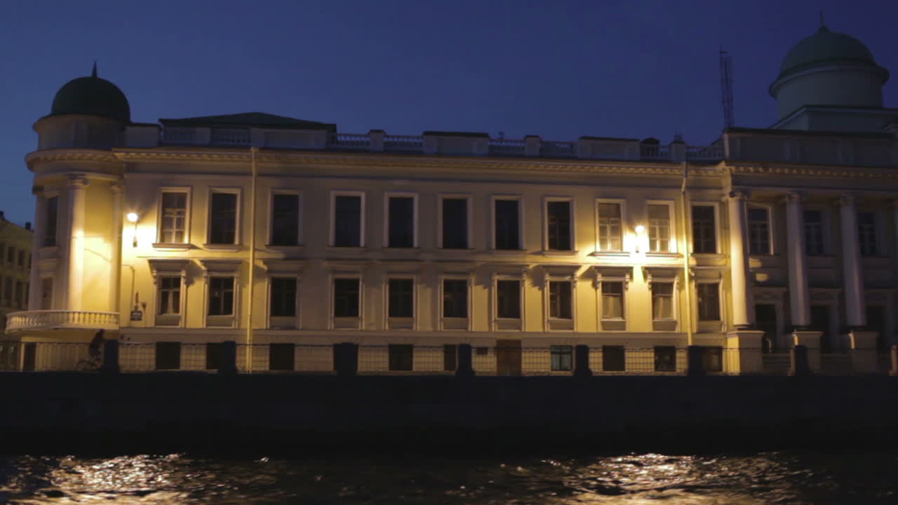 Man on bicycle is going along quay