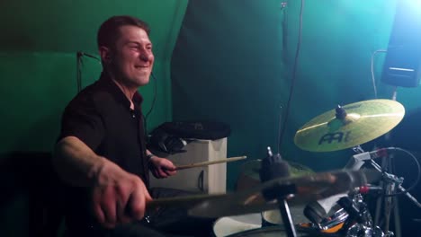 drummer playing drums in a green screen studio