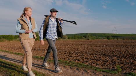 farmers walking through a field