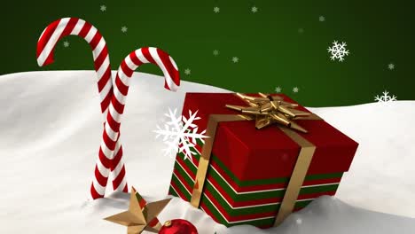 Animation-of-snow-falling-over-christmas-candies-and-present-on-green-background