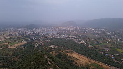 mountain landscape with misty sky at day from flat angle