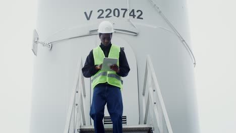 technician working on wind turbine