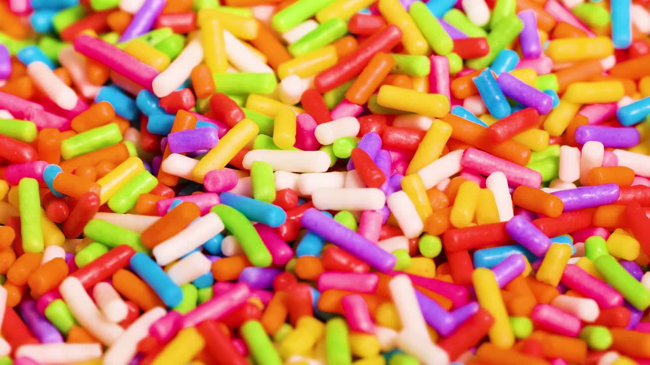 A close-up view of colorful sprinkles showcasing a lively and dynamic pattern.