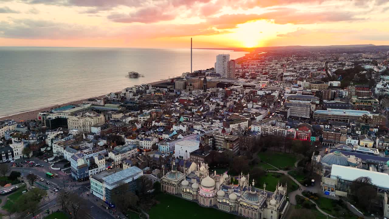 Aerial drone footage soaring over Brighton’s iconic cityscape to its bustling seafront at sunset. Stunning coastal views, golden light, and vibrant city energy captured from above.