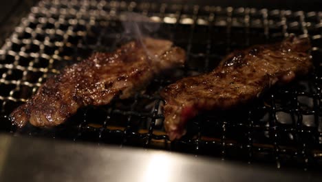 steak grilling on a hot surface, smoke rising