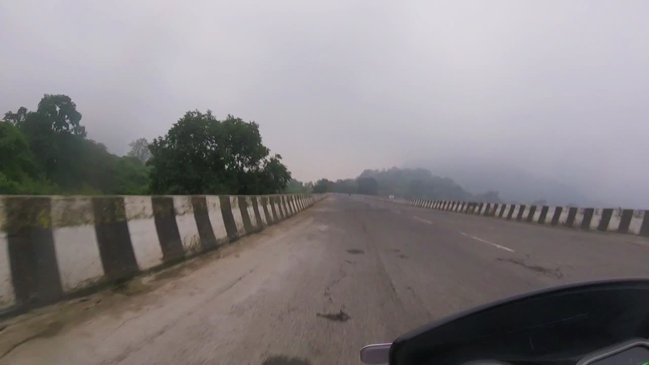 Driving through the empty highway near Pune with foggy clouds rolling along.