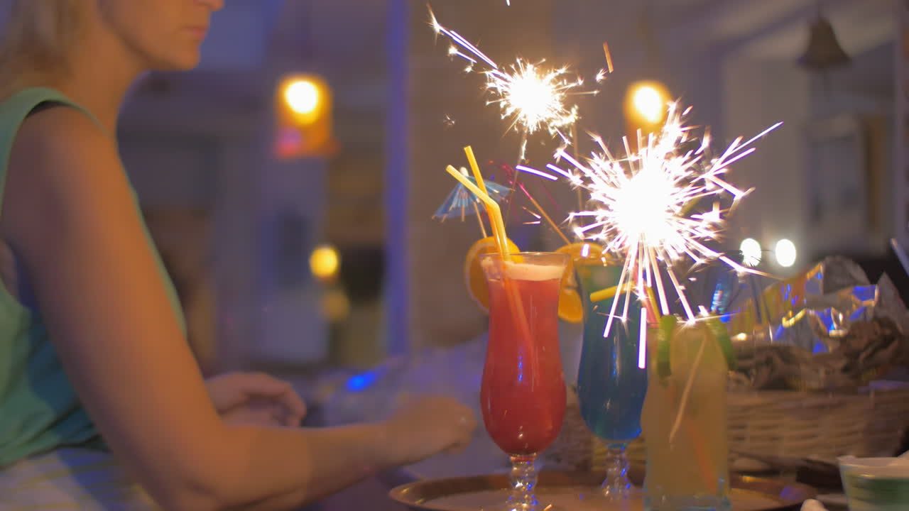 Serving Cocktail Glasses with Sparklers in Them