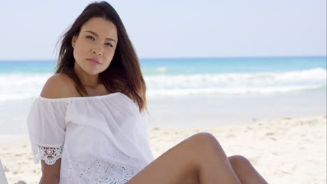 Gorgeous-young-woman-relaxing-on-the-beach