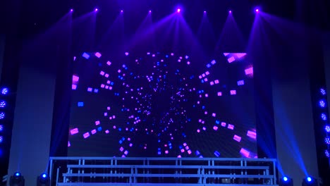animation of stage lights frame. bright shiny stage lights flashing movement entertainment spotlight projectors in the dark, blue soft light spotlight strike on black background.