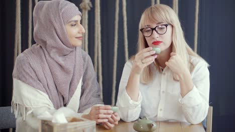 two women friends enjoying tea