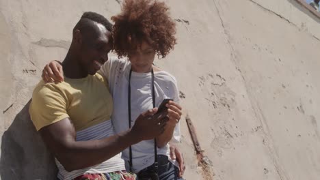 couple using mobile phone on the beach 4k