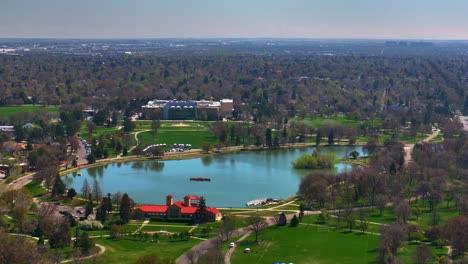 ferril lake denver zoo museum of nature and science city park golf course spring downtown cityscape aerial drone colorado green lush grass sunny blue skies morning neighborhood circle right motion