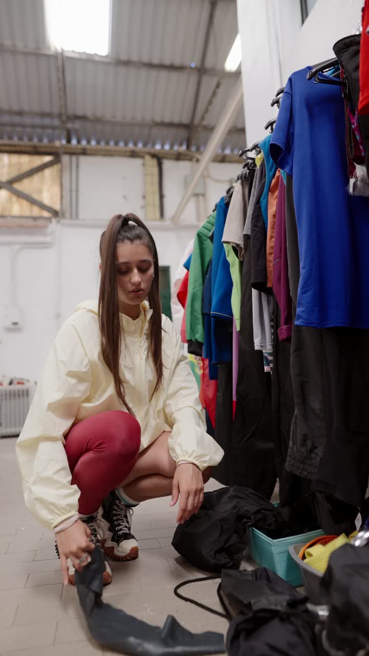 Woman Sorting Clothing Donation