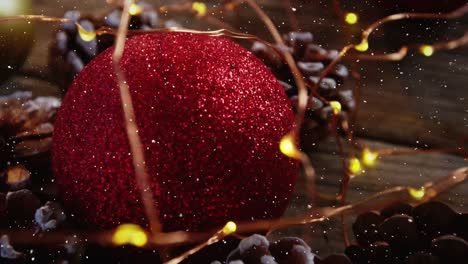 video composition with snow over desk with christmas decoration