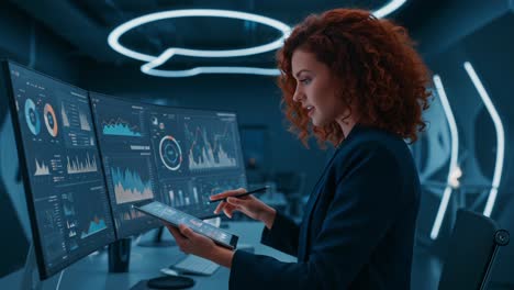 focused professional analyzing data insights on multiple screens in a modern tech environment with advanced graphs and interfaces