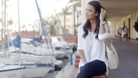 Woman-Relaxing-On-Bench-In-Yacht-Port