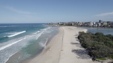 ocean waves in sandy stretch of north entrance beach in nsw, australia