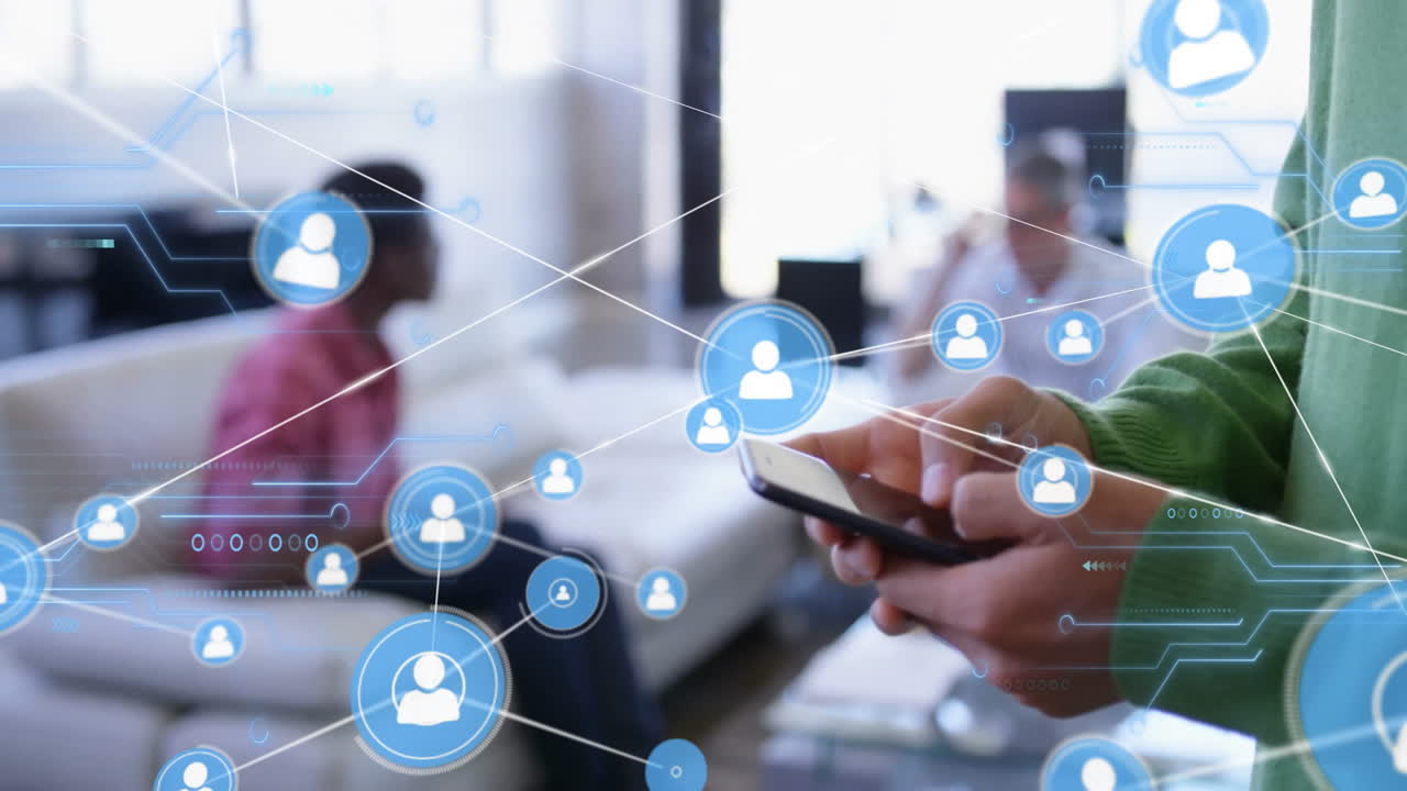 Using smartphone, person viewing animation of social media icons in living room