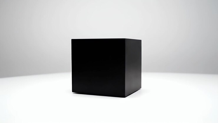 Black Cube Rotating on a White Surface
