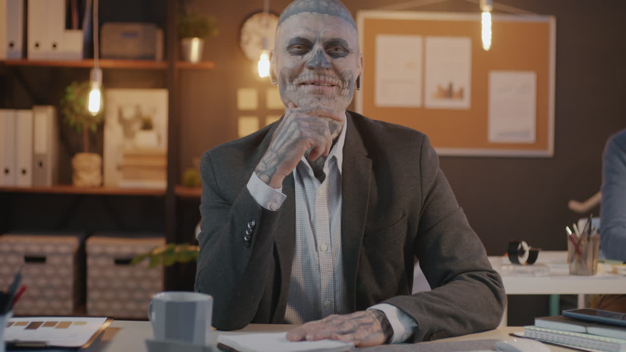 Businessman with Skull Makeup in an Office