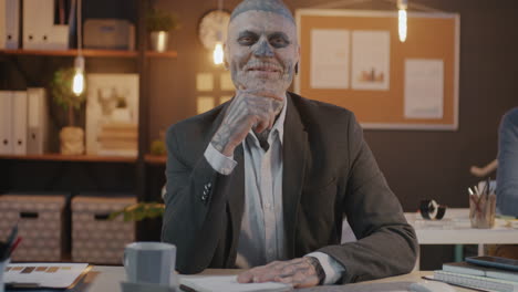 businessman with skull makeup in an office