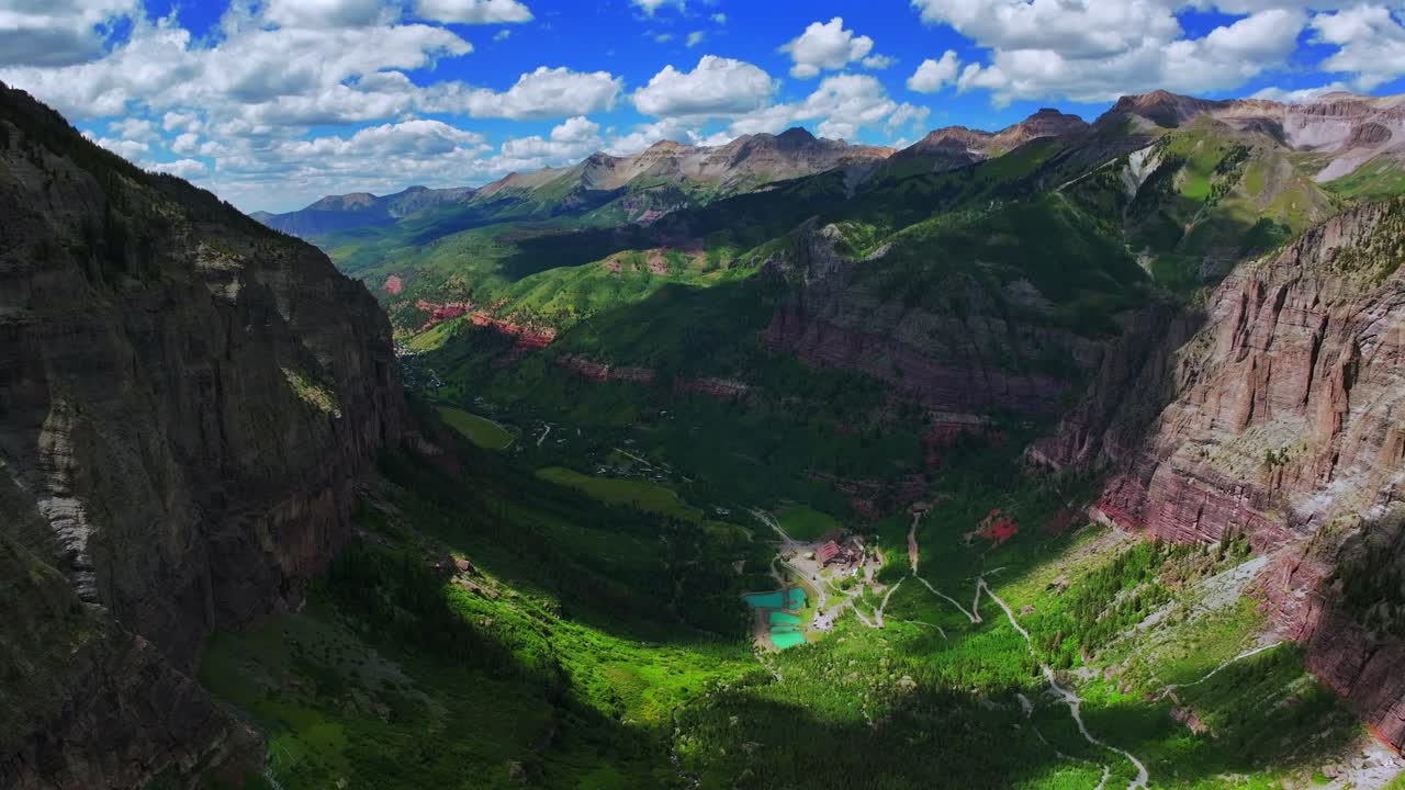 Telluride Box Canyon Colorado Black Bear Pass Road Rocky Mountains 4wd hiking blue sky cliffside valley aerial drone clouds Yankee Boy Basin Ouray Ridgway summer Aspen Forest forward pan up motion