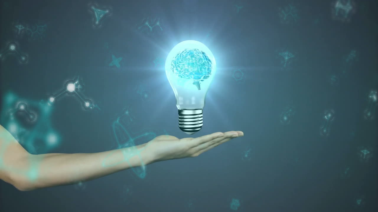 Holding glowing light bulb with brain, hand surrounded by digital animation symbols